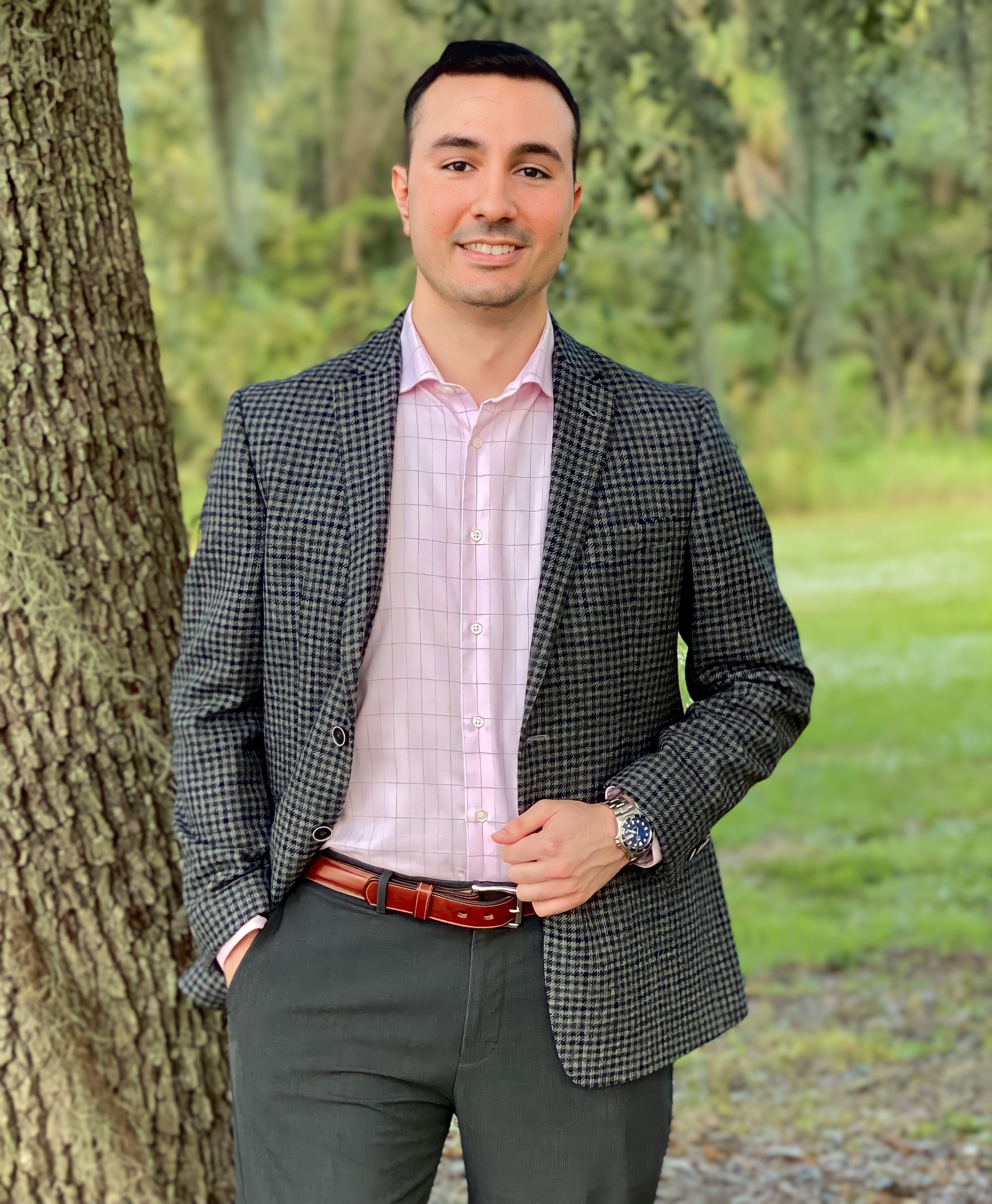 Sam in a blazer by an oak tree